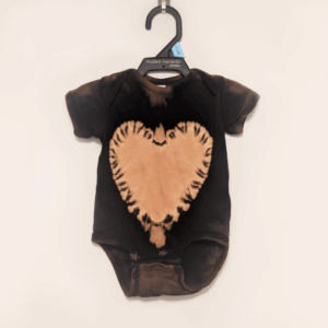 Black baby onesie with hand-bleached heart design in the center