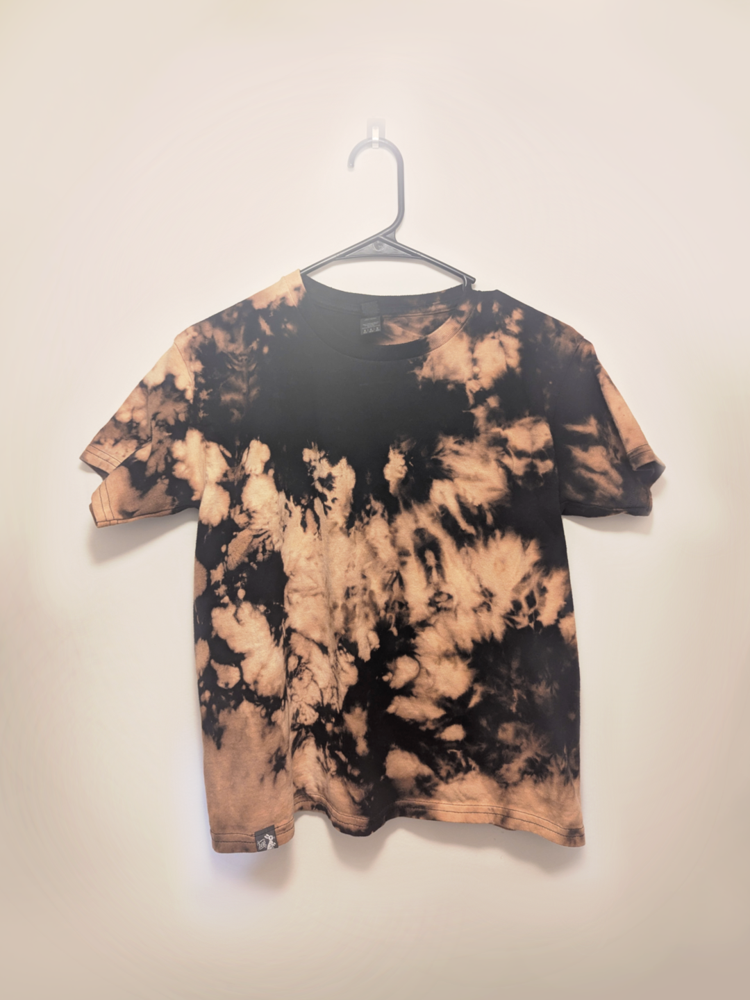 Black kids tee shirt with hand-bleached nebula design in the center