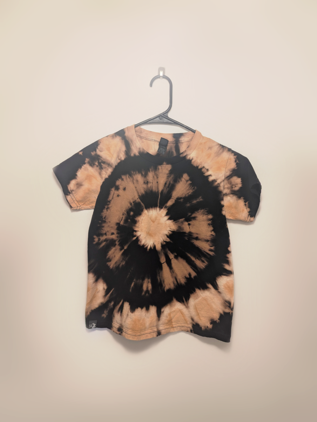 Black kids tee shirt with hand-bleached eye design in the center