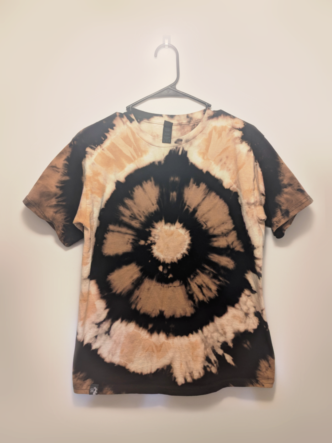 Black kids tee shirt with hand-bleached eye design in the center