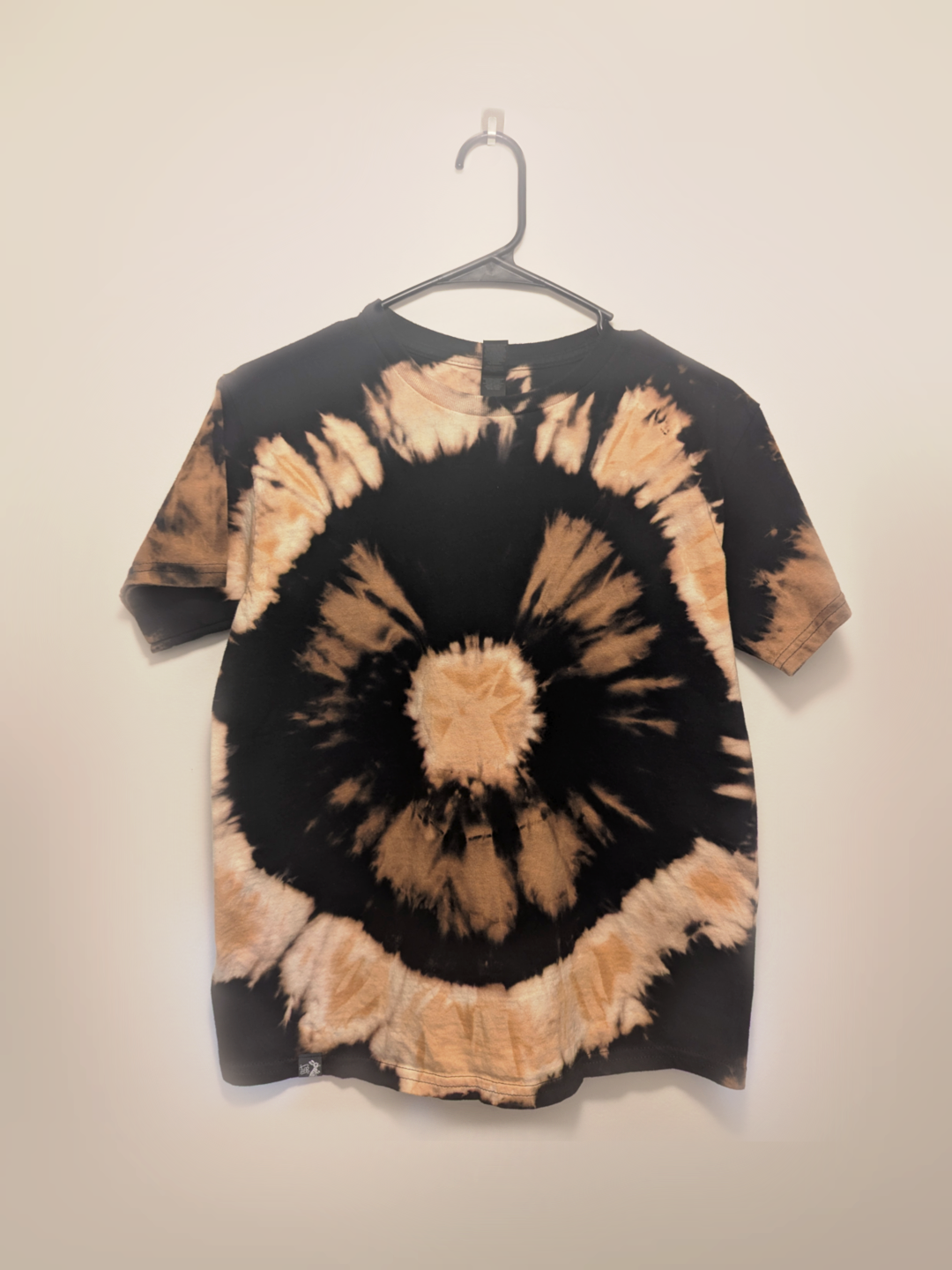 Black kids tee shirt with hand-bleached eye design in the center