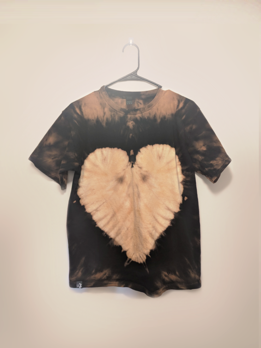 Black kids tee shirt with hand-bleached heart design in the center