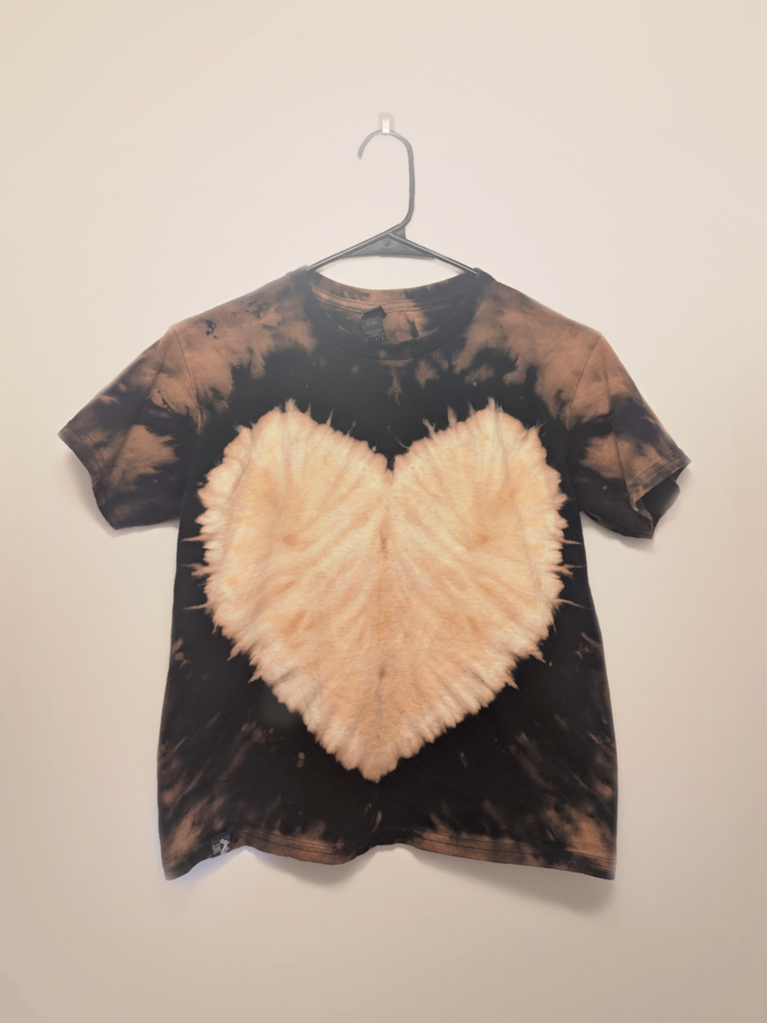 Black kids tee shirt with hand-bleached heart design in the center