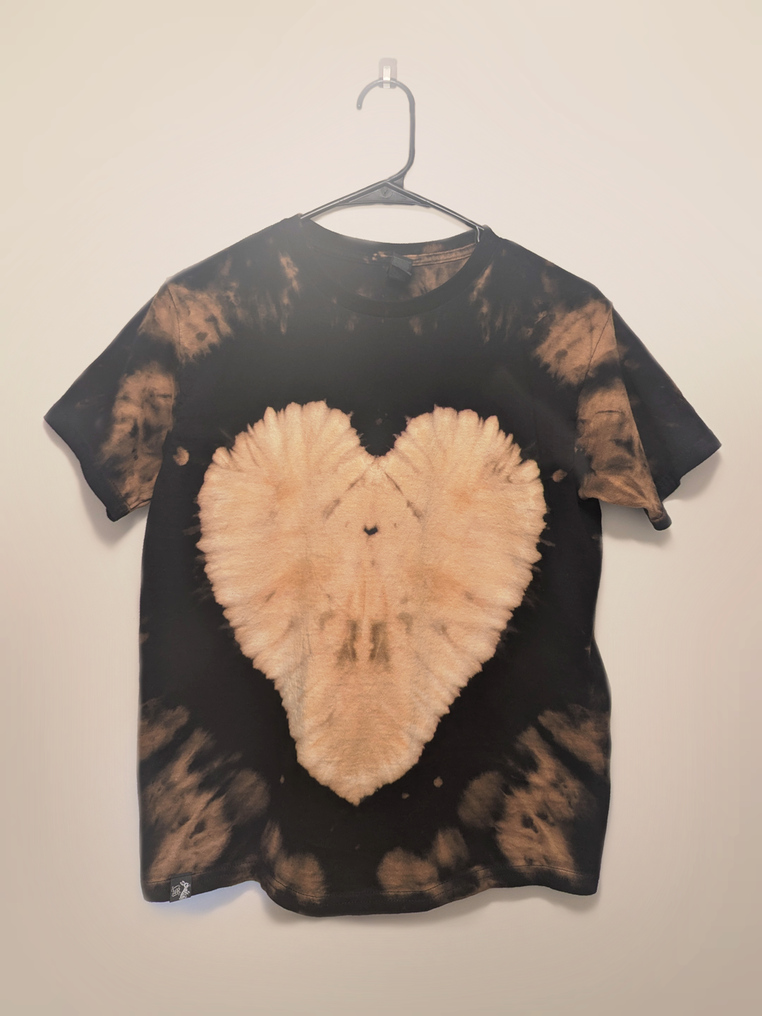 Black kids tee shirt with hand-bleached heart design in the center